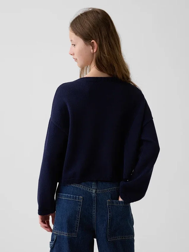 Oversized heklet genser for barn med amerikansk motiv