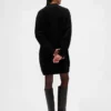 Oversized minigenser i strikk med høyhals