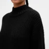 Oversized minigenser i strikk med høyhals