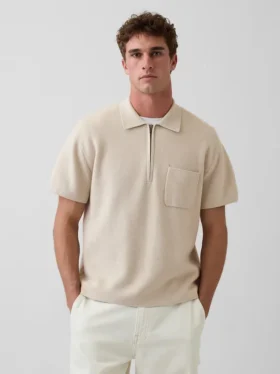 Oversized polo-genser med kvart glidelås og lomme