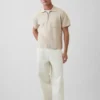 Oversized polo-genser med kvart glidelås og lomme