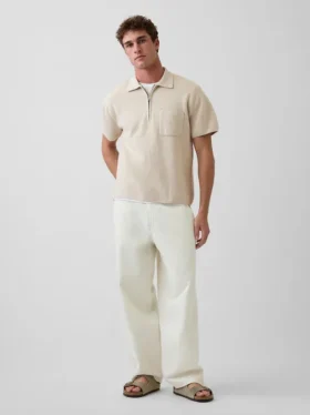 Oversized polo-genser med kvart glidelås og lomme