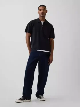 Oversized polo-genser med kvart glidelås og lomme
