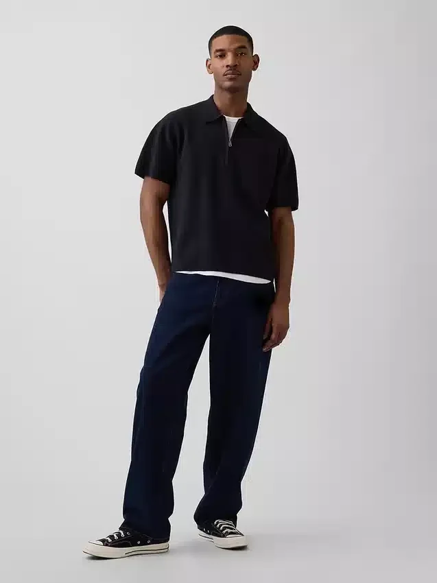 Oversized polo-genser med kvart glidelås og lomme