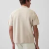 Oversized polo-genser med kvart glidelås og lomme