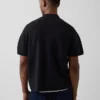 Oversized polo-genser med kvart glidelås og lomme