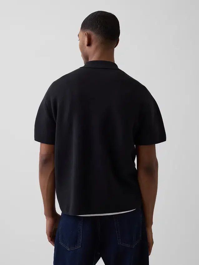 Oversized polo-genser med kvart glidelås og lomme