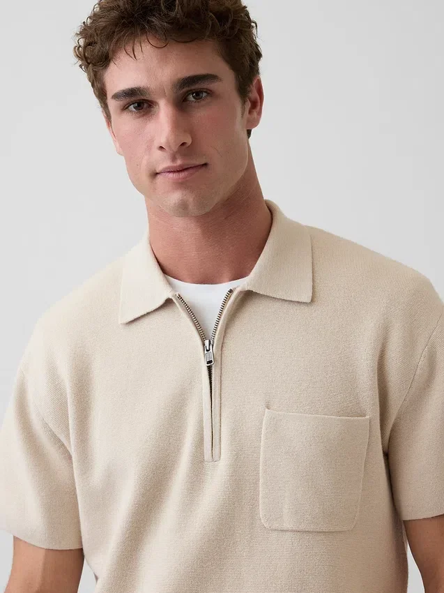 Oversized polo-genser med kvart glidelås og lomme