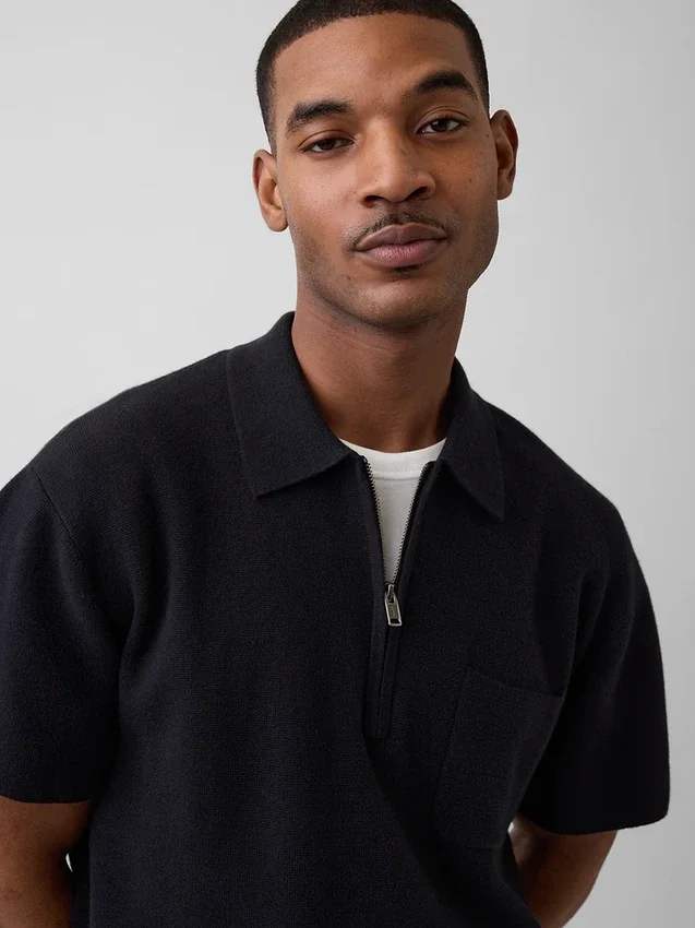 Oversized polo-genser med kvart glidelås og lomme