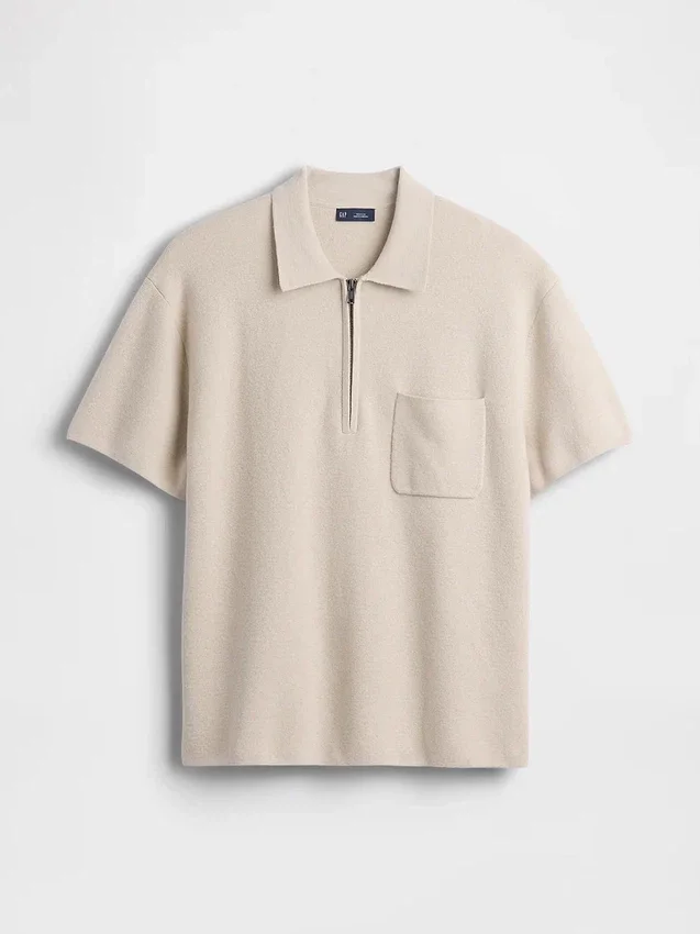 Oversized polo-genser med kvart glidelås og lomme