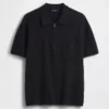 Oversized polo-genser med kvart glidelås og lomme