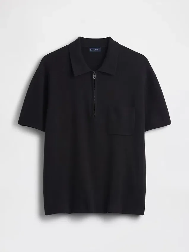 Oversized polo-genser med kvart glidelås og lomme
