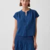 Oversized topp i bomullsgasbind-denim med splitt i halsen