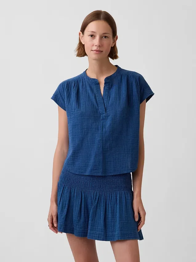 Oversized topp i bomullsgasbind-denim med splitt i halsen
