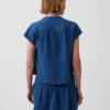 Oversized topp i bomullsgasbind-denim med splitt i halsen