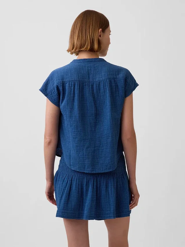 Oversized topp i bomullsgasbind-denim med splitt i halsen