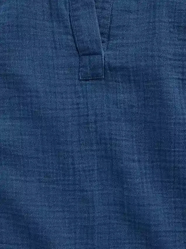 Oversized topp i bomullsgasbind-denim med splitt i halsen