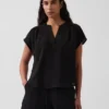 Oversized topp i bomullsgasbind med splitt i halsen