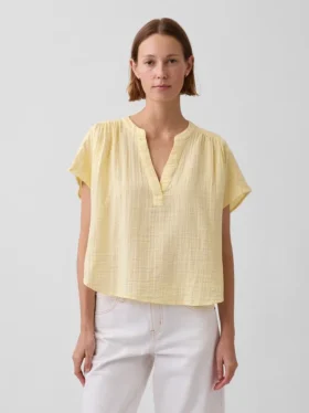 Oversized topp i bomullsgasbind med splitt i halsen