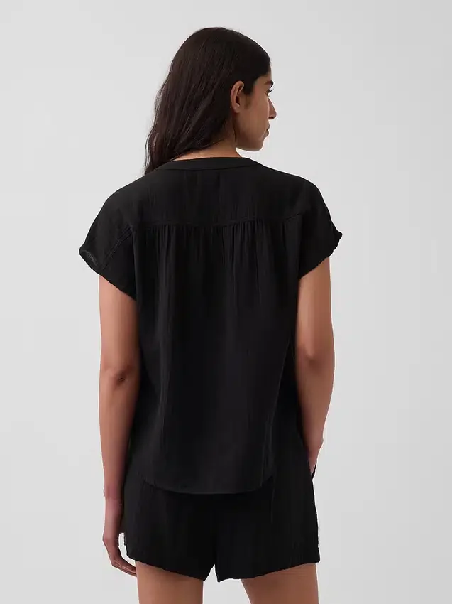 Oversized topp i bomullsgasbind med splitt i halsen