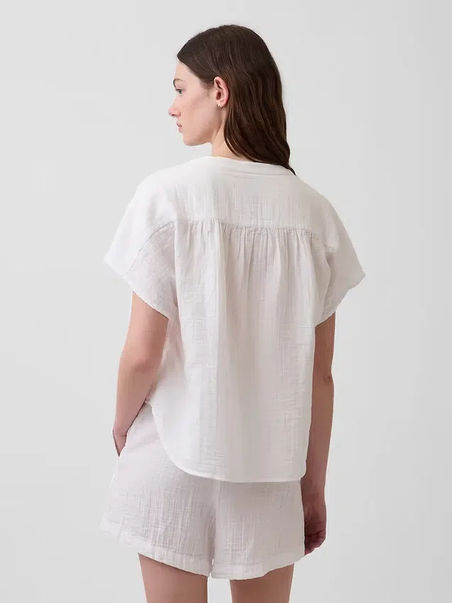 Oversized topp i bomullsgasbind med splitt i halsen