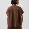 Oversized topp i bomullsgasbind med splitt i halsen