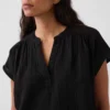 Oversized topp i bomullsgasbind med splitt i halsen