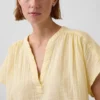 Oversized topp i bomullsgasbind med splitt i halsen