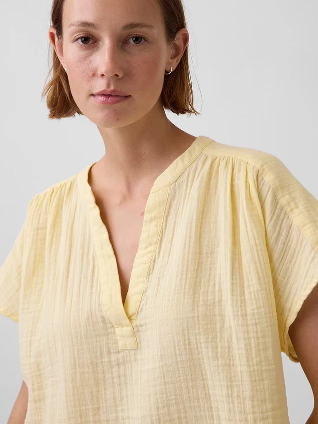 Oversized topp i bomullsgasbind med splitt i halsen