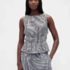 Peplum-top i bomullsgasbind med smock i midjen