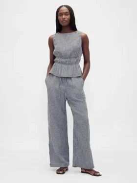 Peplum-top i bomullsgasbind med smock i midjen