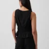 Peplum-top i bomullsgasbind med smock i midjen