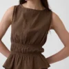 Peplum-top i bomullsgasbind med smock i midjen