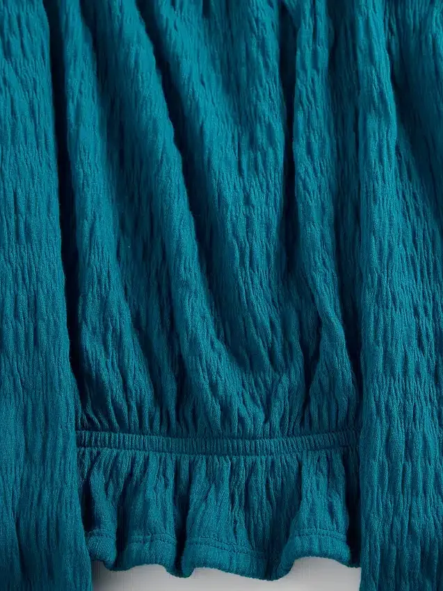 Peplum-top i krøllet stoff til barn