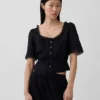 Peplum-top med blonderkant