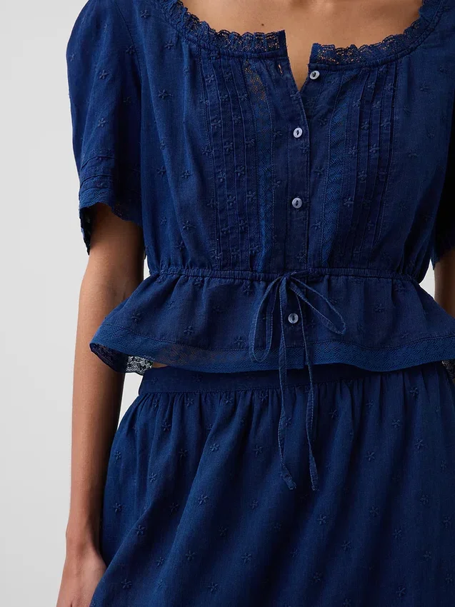 Peplum-top med blonderkant