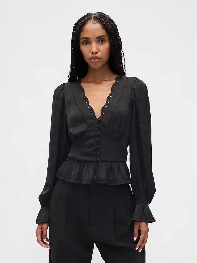 Peplum-top med V-hals og hullmønster