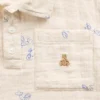 Polo-skjorte i bomullsgasbind med trykk for Baby og Småbarn