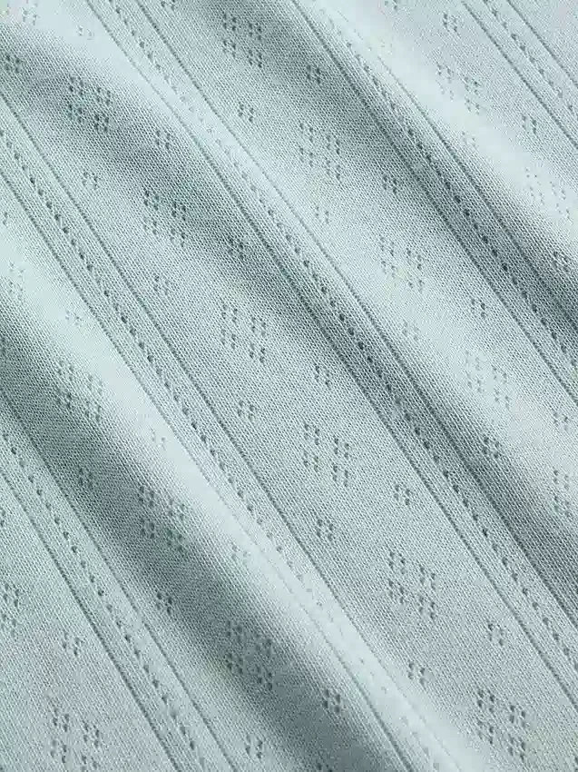 Pyjamasett for barn i resirkulert pointelle-strikk