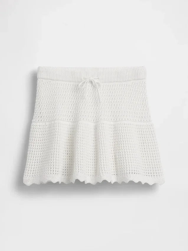 Skort med lag på lag i heklet bomull for barn