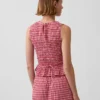 Smokket peplum-top i gingham