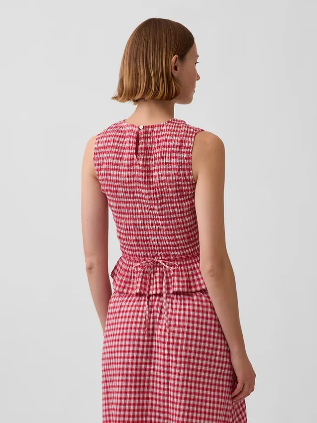 Smokket peplum-top i gingham