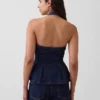 Tettsittende denim-top med halterneck og peplum
