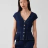 Tettsittende denim-top med kappeerm og peplum