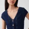 Tettsittende denim-top med kappeerm og peplum