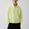 Tung, oversized genser med logo og kvart glidelås