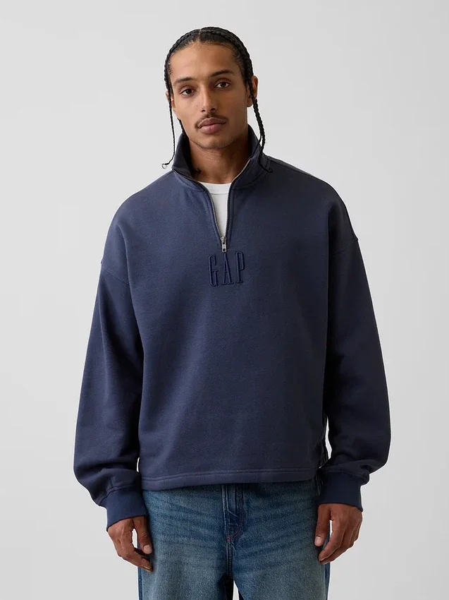 Tung, oversized genser med logo og kvart glidelås