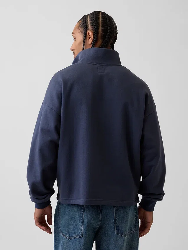 Tung, oversized genser med logo og kvart glidelås