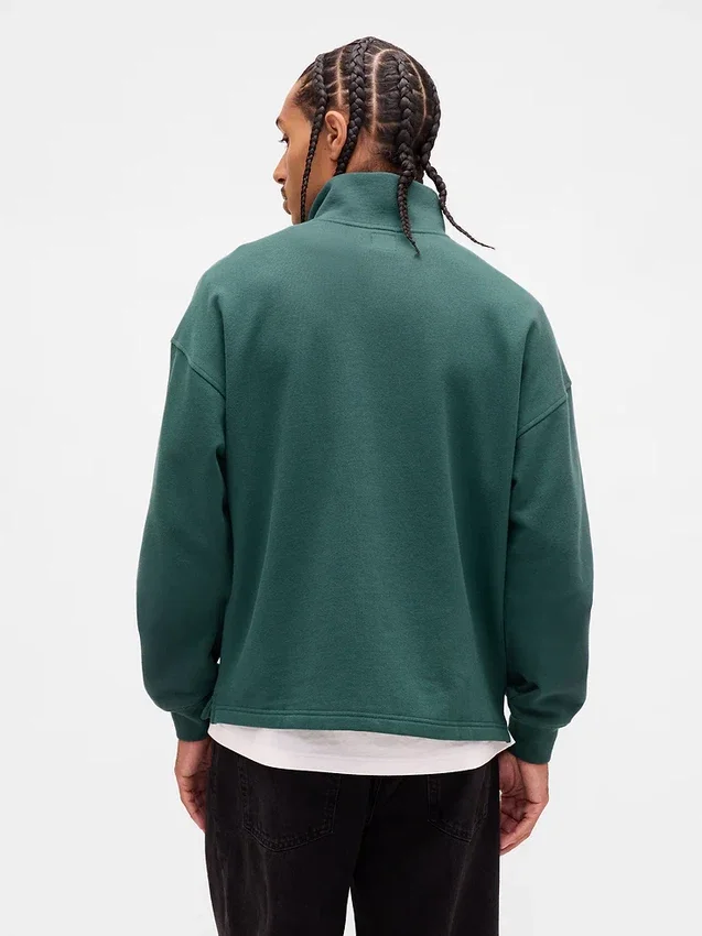 Tung, oversized genser med logo og kvart glidelås