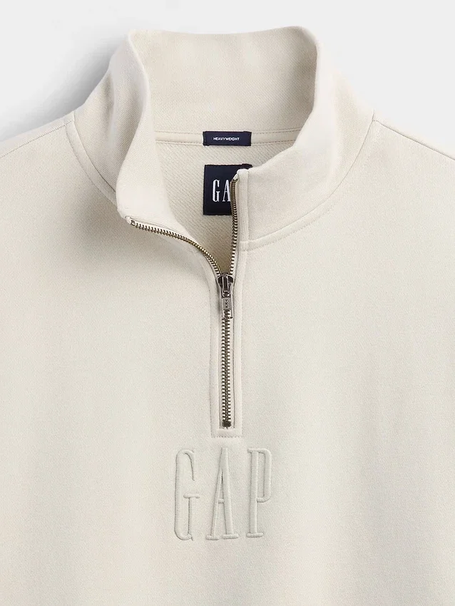 Tung, oversized genser med logo og kvart glidelås